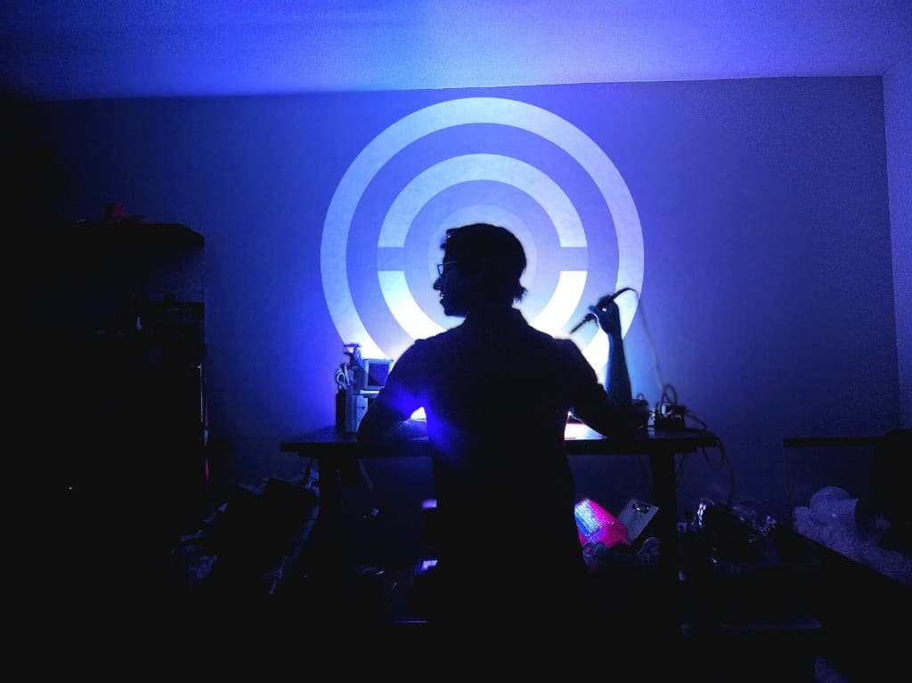 Silhouette at the workbench under Barronix Labs projection lighting